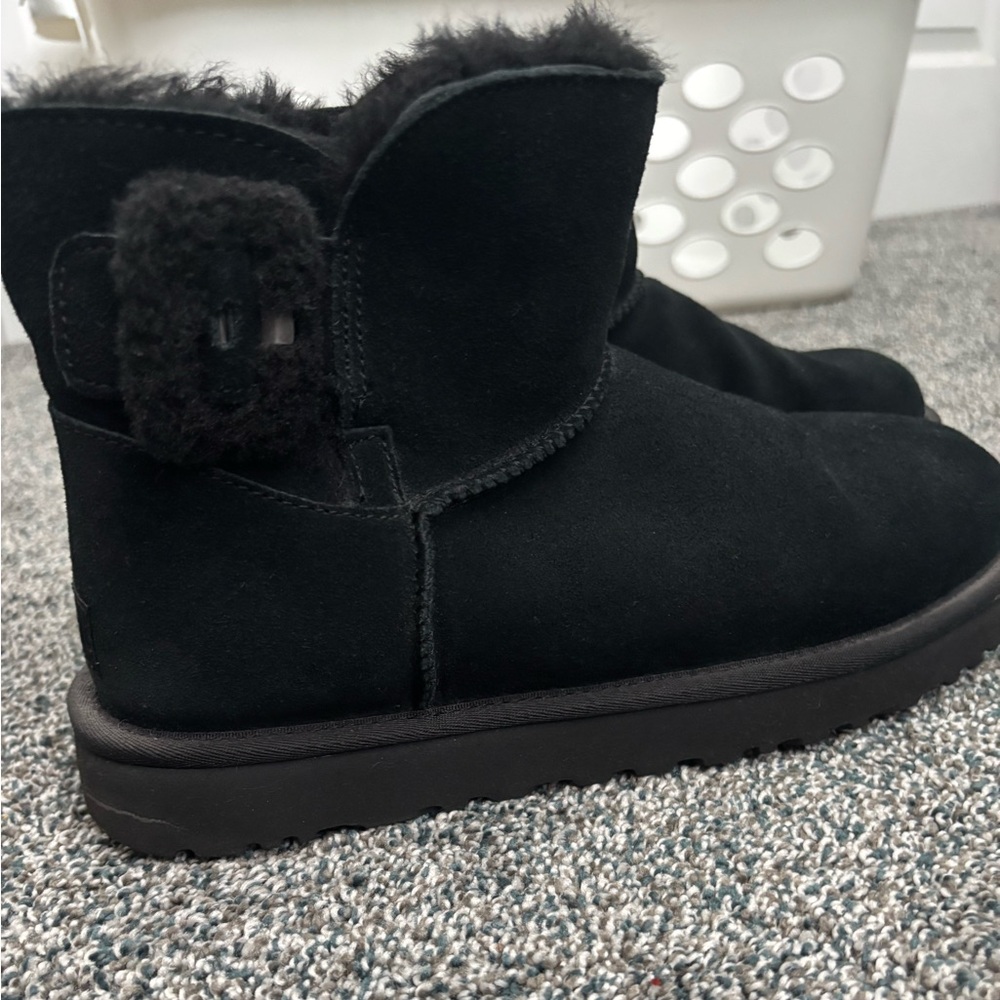 Black short Uggs with black buckle on side. Worn once. Like new